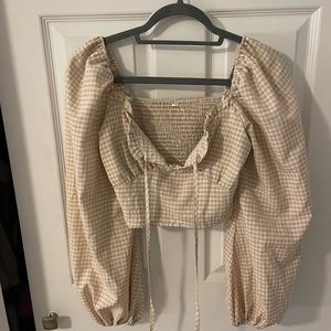 Checkered print long sleeve blouse.